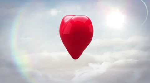 Red heart turning and exploding over blue sky Stock Footage 45374366