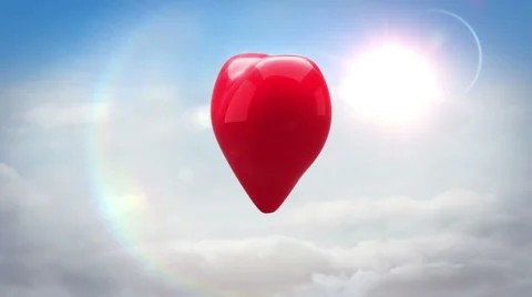 Red heart turning and exploding over blue sky Stock Footage 45374464