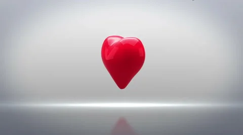 Red heart turning and exploding on grey background Stock Footage 45374854