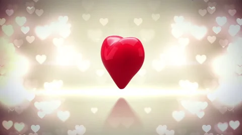 Red heart turning and exploding on glittering background Stock Footage 45374893