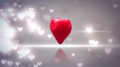 Red heart turning and exploding on glittering background Stock Footage 45374930