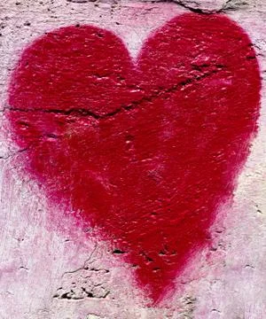 Red heart on the wall Stock Photos