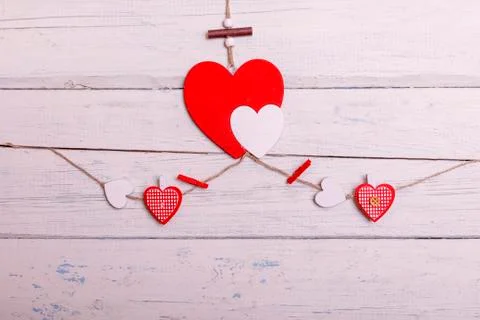 Red heart on white painted rustic wooden background soft focus. Best concept  Stock Photos