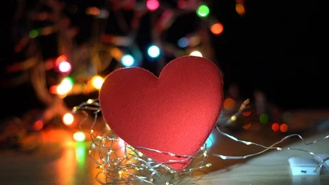 Red heart on a wooden deck with light bokeh background, Stock Footage 124200737