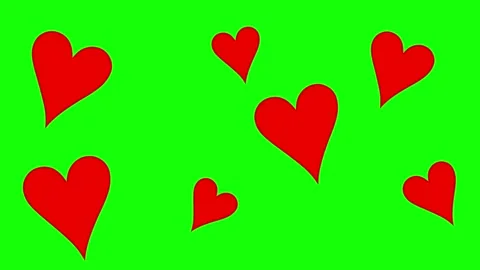 Red hearts are in motion with shaking and popping out effect on green screen Stock Footage 296545614