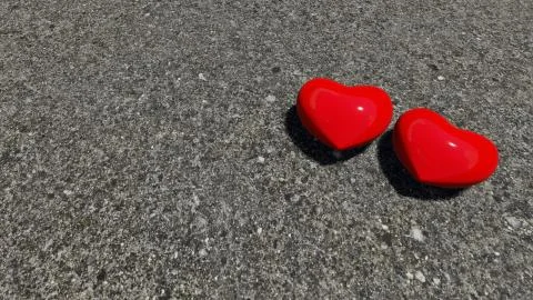 Red hearts on the asphalt Stock Illustration