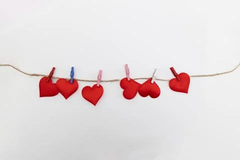 Red Hearts Attached To String With Clothespins For Valentines Day Material Stock Photos