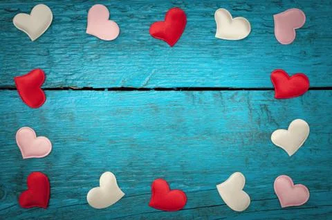 Red hearts on the blue boards Stock Photos