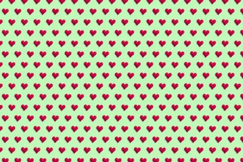 Red hearts on a colored mint background. Pattern for the design of textiles a Stock Photos