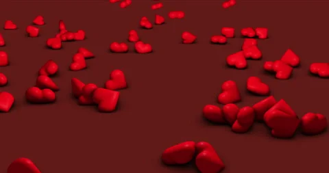 Red hearts falling and rolling down an inclined surface Stock Footage 260721214