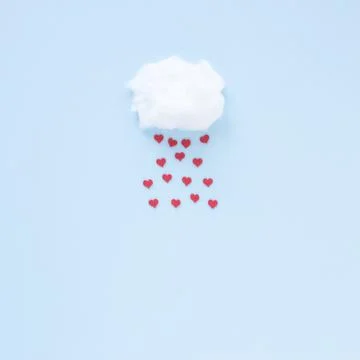 Red hearts falling from cloud . High quality and resolution beautiful photo Stock Photos