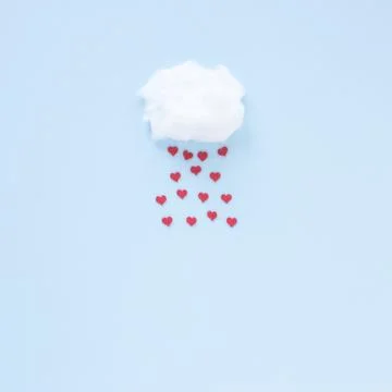 Red hearts falling from cloud . High quality and resolution beautiful photo.. Stock Photos