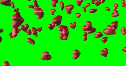 Red hearts falling green background Stock Footage 85388915
