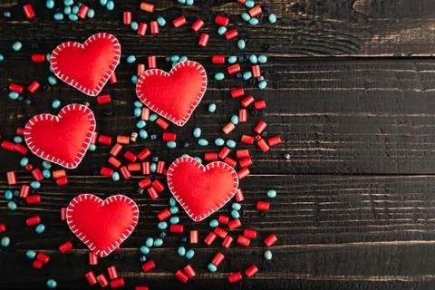 Red hearts from felt on the table Stock Photos