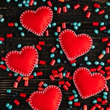 Red hearts from felt on the table Stock Photos