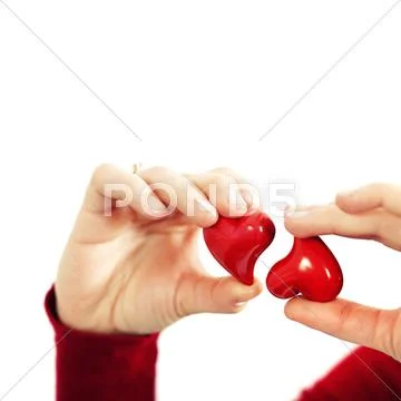 Red hearts in hands - st. valentine concept Stock Photos