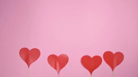 Red hearts on pink background. Stock Footage 147947182