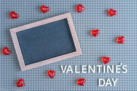 Red hearts with a rectangular frame for inscriptions. Valentine's day concept. Stockfoto's
