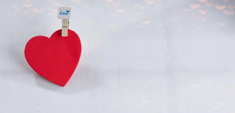 Red hearts set on string over white background. Stock Photos