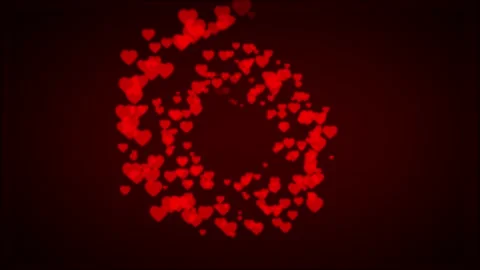 Red hearts shape particles moving forward in radial path Stock Footage 134150625