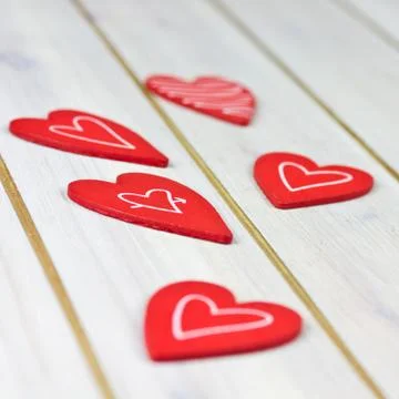 Red hearts on table Foto stock
