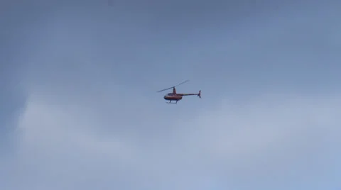 Red helicopter in flight Stock Footage 35476777