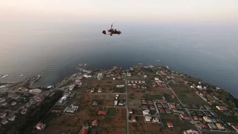 Red helicopter flying during sunset Stock Footage 143965671