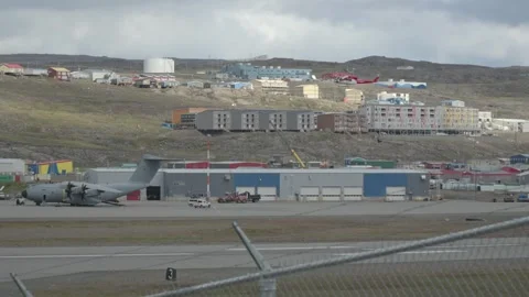 Red Helicopter Landing Approach, Passing in Front of RAF Atlas Aircraft Stock Footage 343433167