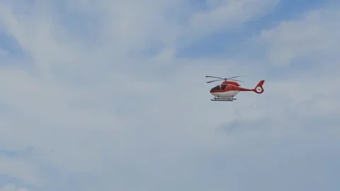 Red helicopter in sky video Stock Footage 308310542