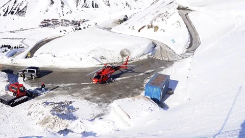 Red helicopter at winter mountains Stock Footage 125849972