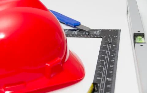 Red Helmet and tools for construction drawings and buildings Stock Photos