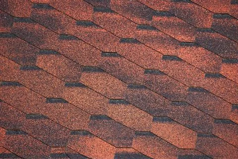 Red hexagonal flexible shingles, modern roof pattern, background texture Stock Photos