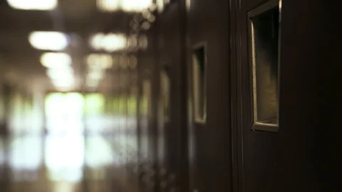 Red high school lockers, narrow hallway. 스톡 동영상 109854788