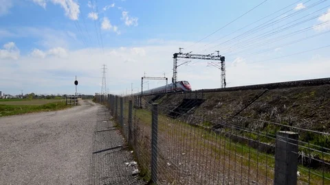 Red high speed train moving very fast Stock Footage 105356743