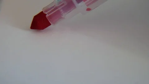 Red highlighter whiting on white paper, macro shot Stock Footage 111866366