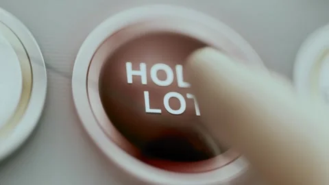 Red hold lot button dominates dark panel Stock Footage 344095504