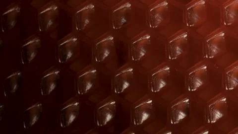 Red honeycomb. dark background with hexagonal beeswax elements. Stock Footage 302914408