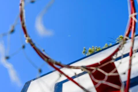 Red hoop frames a vibrant blue sky Stock Photos