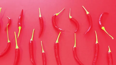 Red hot chili peppers pattern flat lay on red background 库存影片 338302482