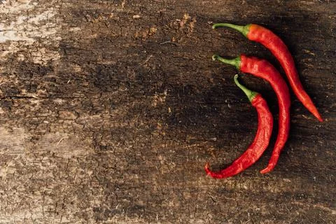 Red hot chili peppers on wood Stock Photos