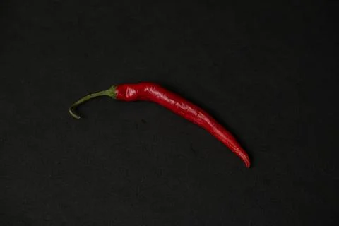 Red hot chilli on the dark table Stock Photos