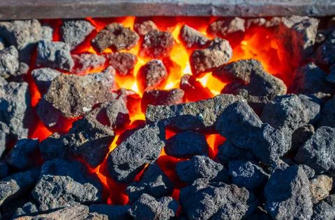 Red-hot coke in a forge Stock Photos