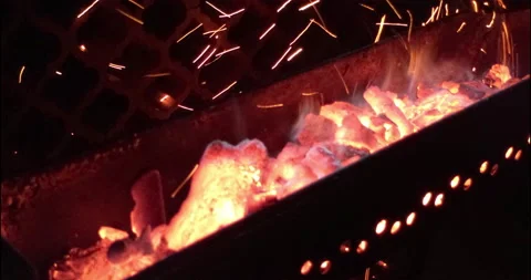 Red-hot embers poured over the grill Stock Footage 146647363