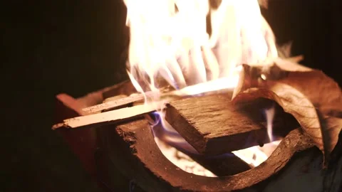 Red hot fire charcoal with burning tree leaves Stock Footage 139027140