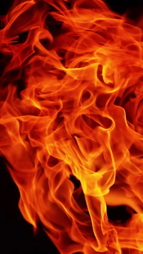 Red hot fire flames twirling in the darkness. Stock Footage 316261953