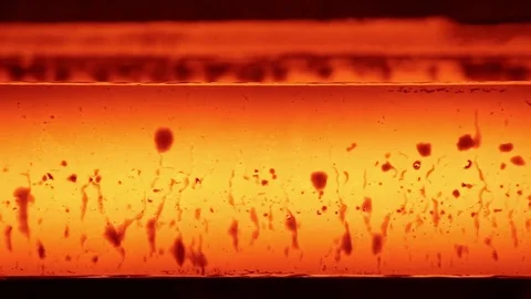 Red-hot iron balk move in the discharge line in the steel shop Stock Footage 72757993