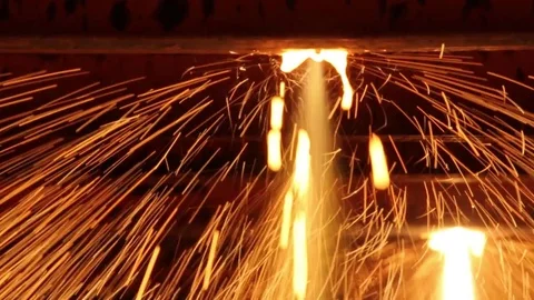 Red-hot iron balk move in the discharge line in the steel shop Stock Footage 72758589