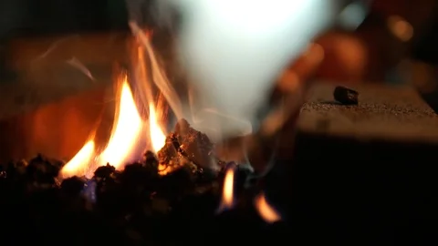 Red hot Iron pulled from hearth to be forged slow mo 動画素材 89539155