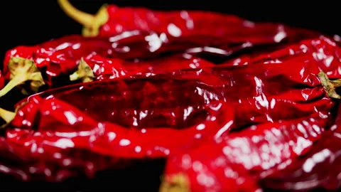 Red hot pepper on a black background. Harvesting vegetables on the farm. Stock Footage 165045175