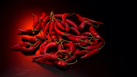 Red hot pepper in a dark studio Video stock 283720162
